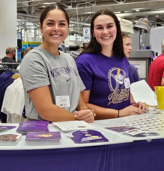 Volunteers working at the UNI Iowa State Fair booth